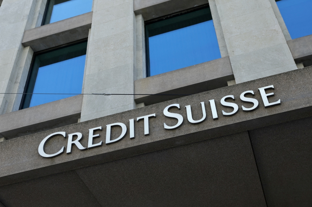 FILE PHOTO: A logo is pictured on the Credit Suisse bank in Geneva, Switzerland, June 9, 2022. REUTERS/Denis Balibouse