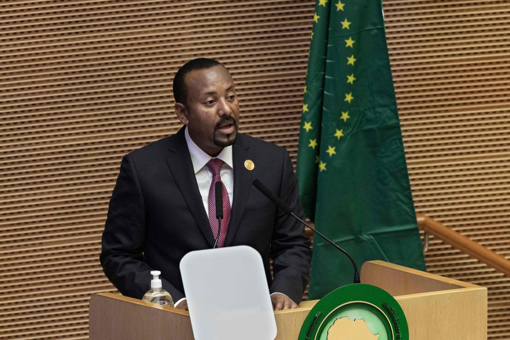 In this file photo taken on February 05, 2022 Ethiopia's Prime Minister Abiy Ahmed speaks during the 35th Ordinary Session of the African Union (AU) Summit in Addis Ababa, Ethiopia. (Photo by Tony KARUMBA / AFP)