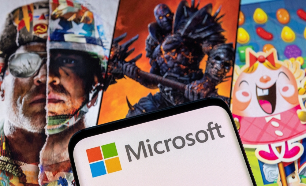 Microsoft logo is seen on a smartphone placed on displayed Activision Blizzard's games characters in this illustration taken January 18, 2022. (REUTERS/Dado Ruvic/Illustration)