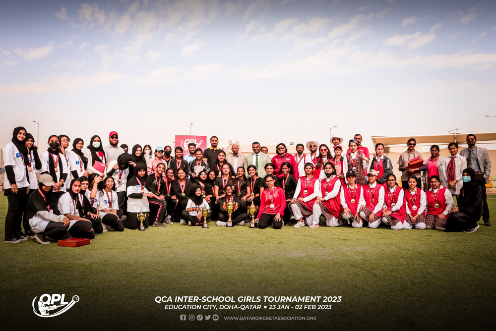 Players and officials of Pakistan International School and Birla Public School pose for a photograph with the officials of the Qatar Cricket Association after the final.