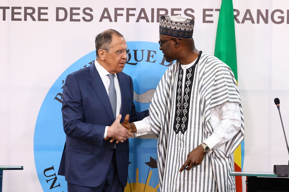 Russian Foreign Minister Sergei Lavrov and Malian Foreign Minister Abdoulaye Diop hold a joint press conference following their talks in Bamako on February 7, 2023. (Photo by RUSSIAN FOREIGN MINISTRY / AFP) 