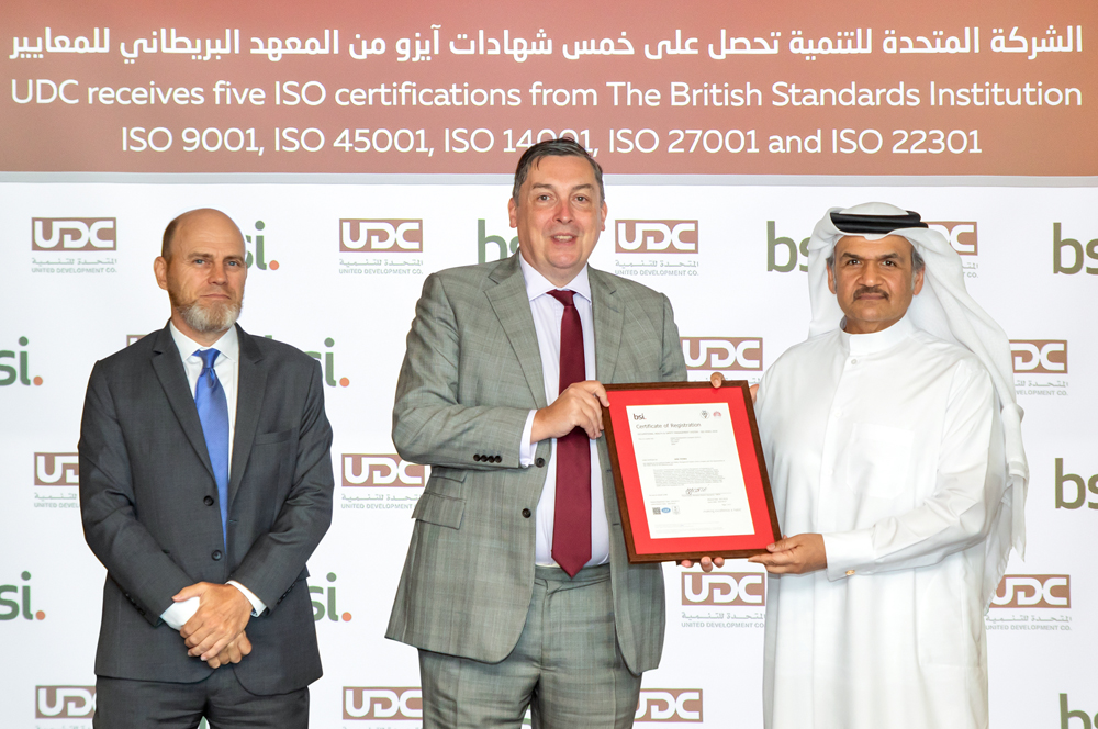 UDC President, CEO and Member of the Board Ibrahim Jassim Al Othman receives the certificates from Jon Wilks, the British Ambassador to the State of Qatar.