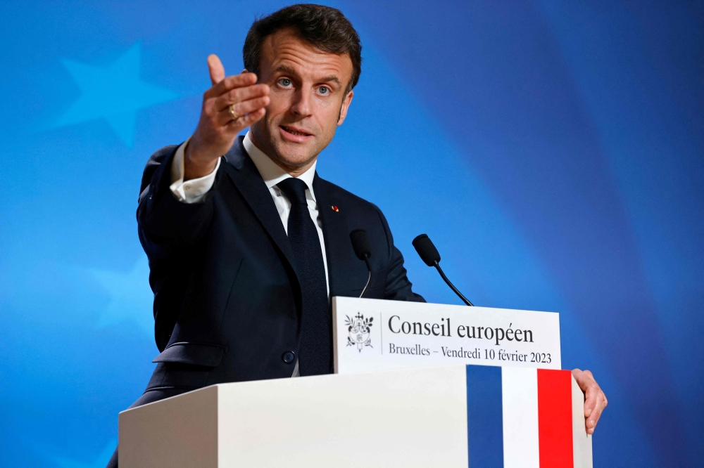 France's President Emmanuel Macron speaks during a press conference at the end of an extraordinary meeting of a EU leaders Summit at The European Council Building in Brussels on February 10, 2023. (Photo by Ludovic MARIN / AFP)