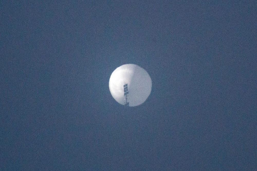 This file photo taken on February 01, 2023, shows a suspected Chinese spy balloon in the sky over Billings, Montana. (Photo by Chase Doak / AFP)