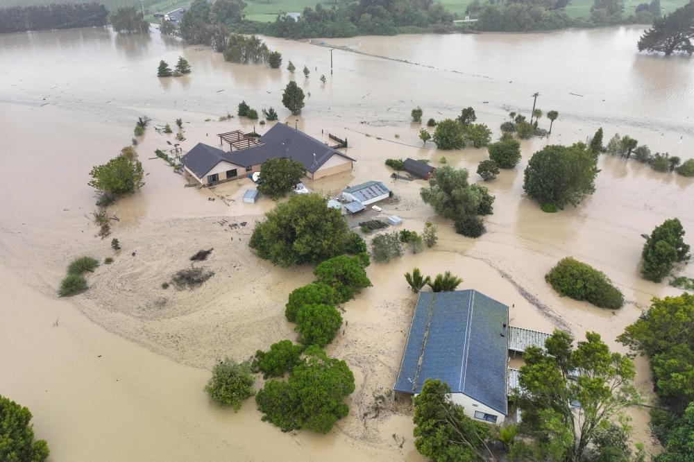 An aerial photo taken on February 14, 2023 shows flooding caused by Cyclone Gabrielle in Awatoto, near the city of Napier. Photo by AFP