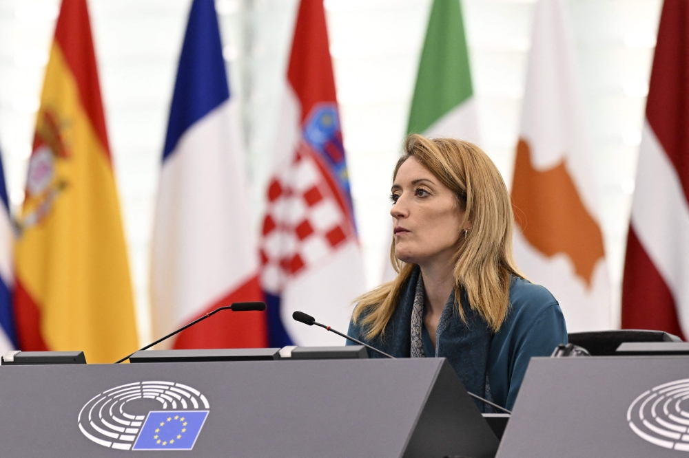 European Parliament President Roberta Metsola looks on as Latvia's President delivers a speech as part of a plenary session at the European Parliament in Strasbourg, eastern France, on February 14, 2023. (Photo by FREDERICK FLORIN / AFP)
 