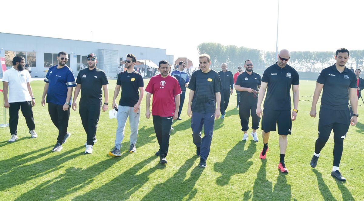 Dr. Hassan Al Derham, President of Qatar University, and Dr. Khalid Al Khater, Vice President of Administration and Financial Affairs, touring the area with other officials.