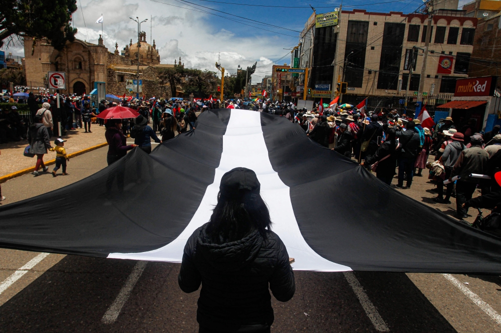 File Photo: Demonstrators hold a protest against the government of Peruvian President Dina Boluarte and to demand her resignation, in Juliaca, southern Peru, on January 27, 2023.