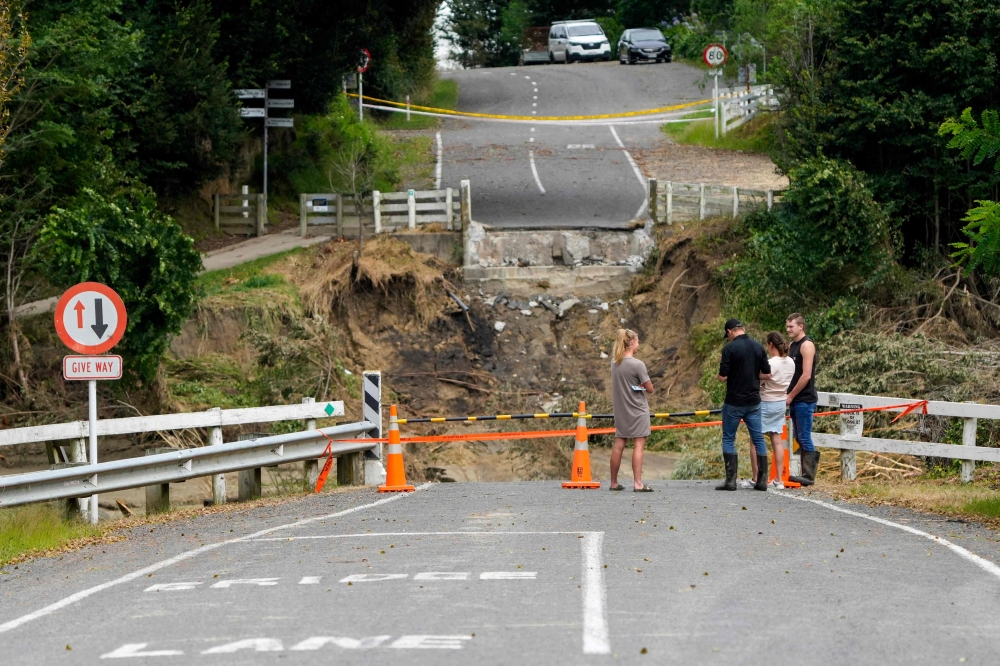 This photo shows the remains of the Puketapu Bridge that washed away during Cyclone Gabrielle near Napier on February 16, 2023. Photo by AFP