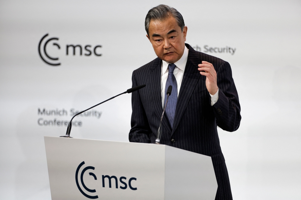 China's Director of the Office of the Central Foreign Affairs Commission Wang Yi delivers a speech at the Munich Security Conference (MSC), on February 18, 2023. (Photo by Odd Andersen / AFP)
 