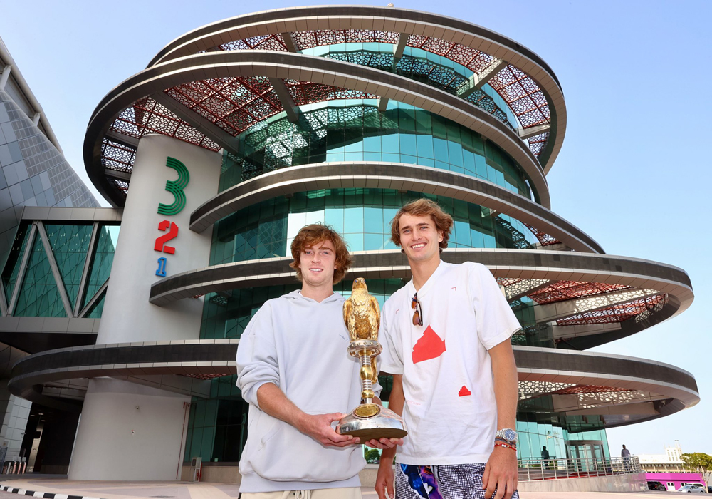 Alex Zverev and Andrey Rublev pose for a photograph with the Qatar ExxonMobil Open trophy during their visit to the 3-2-1 Olympic and Sport Museum, yesterday.