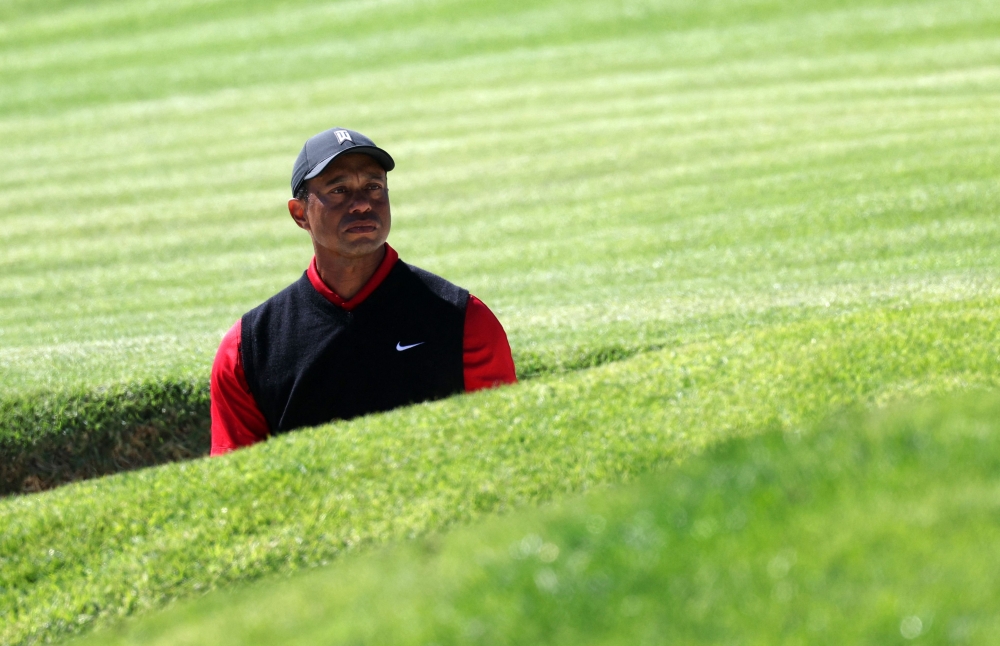Tiger Woods of the United States reacts to his shot out of a bunker on the 17th hole during the final round of the The Genesis Invitational at Riviera Country Club on February 19, 2023 in Pacific Palisades, California. (Harry How/Getty Images/AFP)