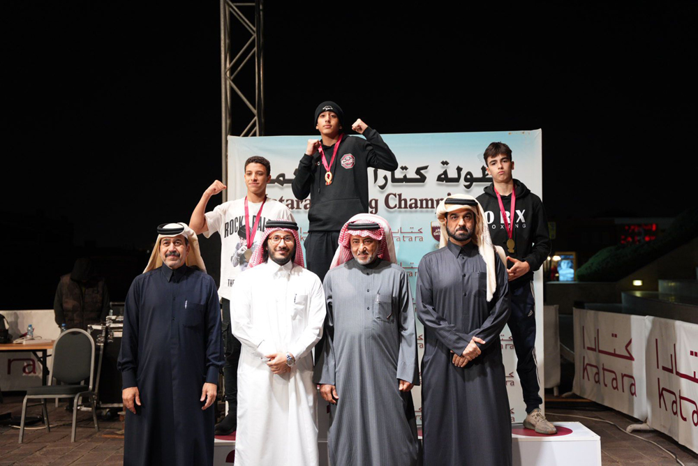  Qatar Boxing Federation President Sheikh Fahd bin Khalid Al Thani and  other officials pose with podium winners during the presentation ceremony.