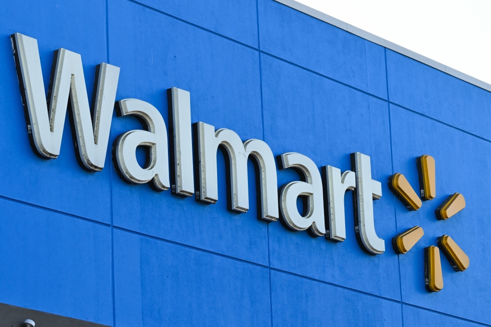 (FILES) In this file photo taken on August 15, 2022 The Walmart logo is seen outside a Walmart store in Burbank, California. - Walmart reported better-than-expected profits over the critical holiday-season quarter February 21, 2023, but offered a disappointing outlook as inflation weighs on consumers. (Photo by Robyn Beck / AFP)