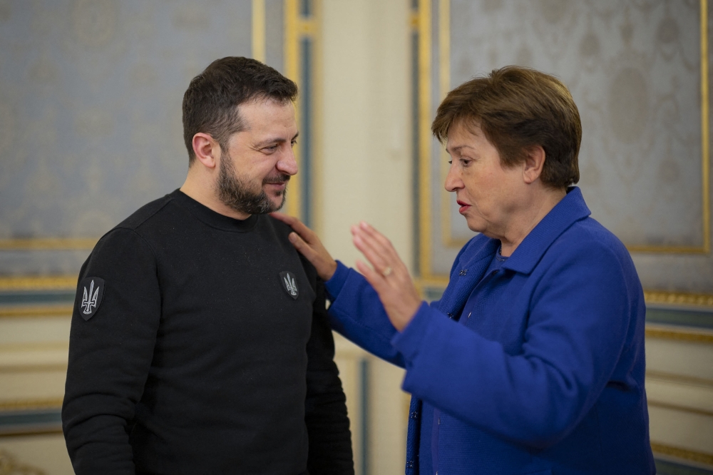 This handout picture taken and released by the Ukrainian Presidential press service on February 20, 2023 shows Ukrainian President Volodymyr Zelensky welcoming International Monetary Fund Managing Director Kristalina Georgieva for a meeting in Kyiv, amid the Russian invasion of Ukraine. (Photo by Handout / UKRAINIAN PRESIDENTIAL PRESS SERVICE / AFP) 