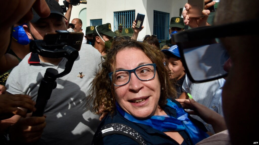 FILE - Amira Bouraoui is greeted upon her release from prison on July 2, 2020, outside the Kolea Prison near the city of Tipasa, 70km west of the capital Algiers.  AFP