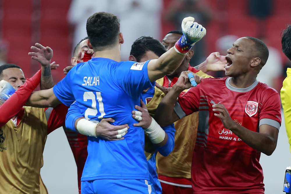 Al Duhail goalkeeper Salah Zakaria celebrates with teammates after their win over Al Rayyan on Sunday. PIC: RAJAN VADAKKEMURIYIL