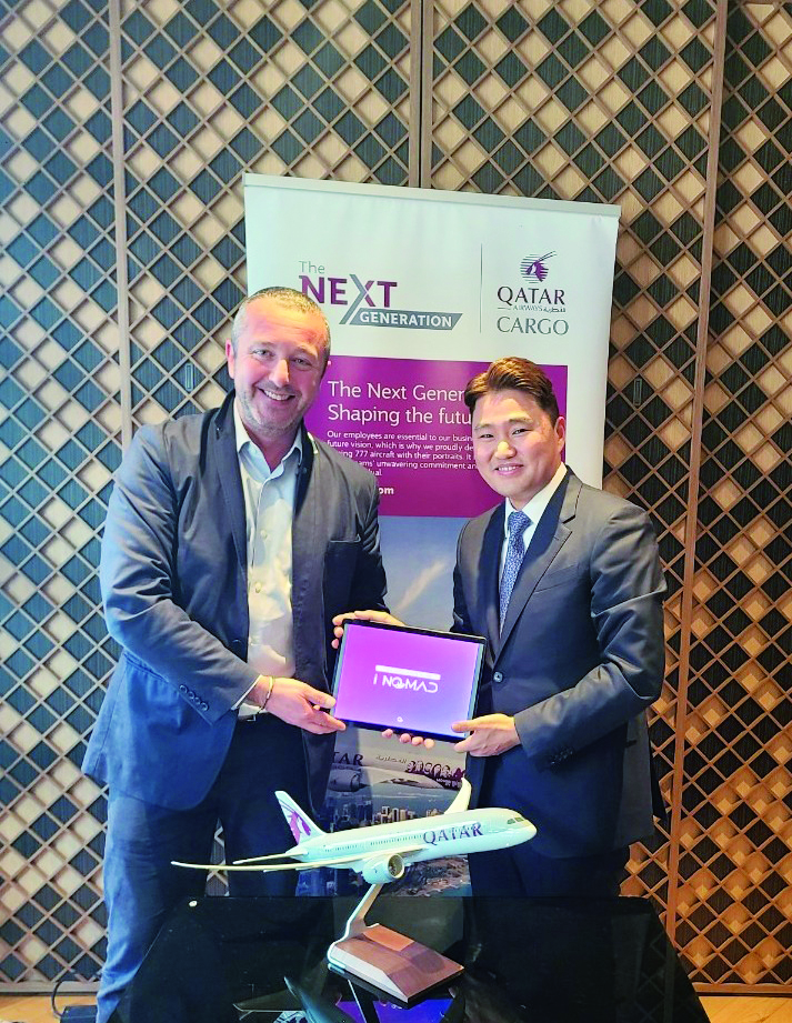 Qatar Airways Cargo and iNOMAD officials mark the partnership.