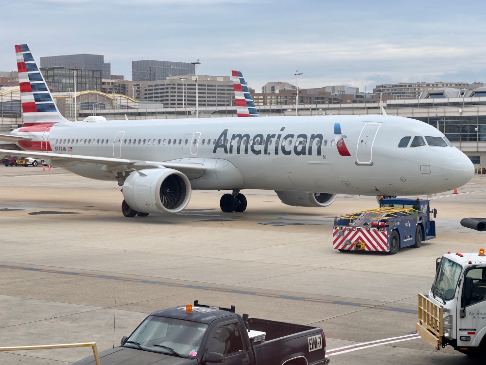 An American Airlines plane sits at the gate at Ronald Reagan Washington National Airport (DCA) in Arlington, Virginia on february 23, 2023. (Photo by Daniel SLIM / AFP)