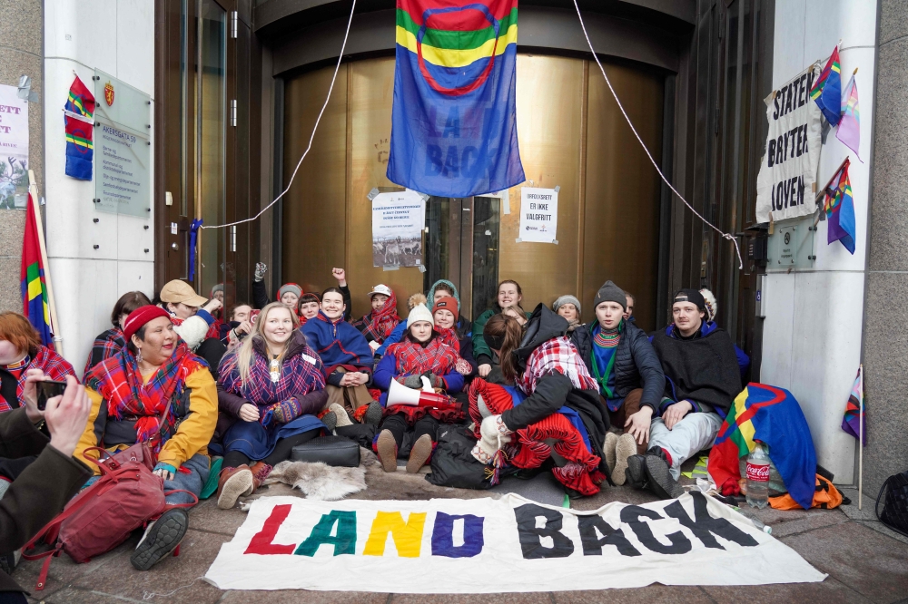Sweden's Greta Thunberg (rear, 3rd R) and other young climate activists from the 