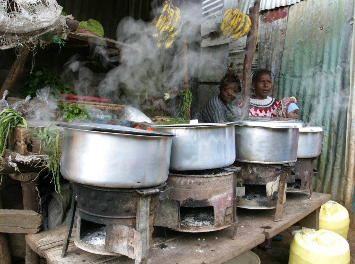 File Photo: Women sit next to their cooking stoves at the sprawling Kibera slums in Kenya's capital Nairobi, June 8, 2009. (Reuters/Noor Khamis)