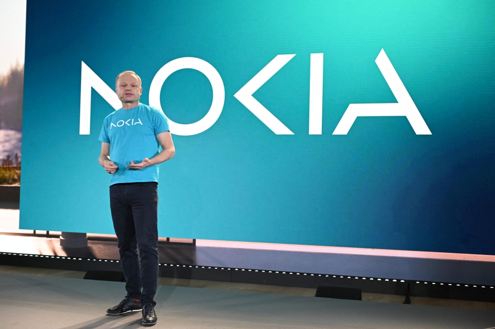 Nokia President and CEO Pekka Lundmark presents Nokia new logo at the Mobile World Congress (MWC), the telecom industry's biggest annual gathering, in Barcelona on February 26, 2023. (Photo by Josep LAGO / AFP)