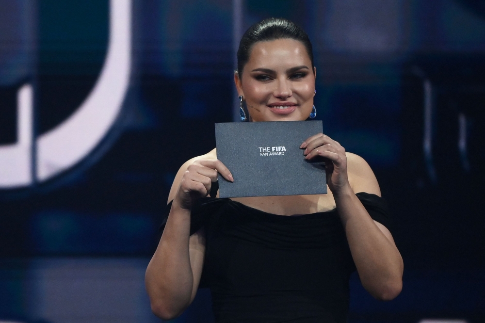 Brazilian model Adriana Lima stands on stage during the Best FIFA Football Awards 2022 ceremony in Paris on February 27, 2023. (Photo by FRANCK FIFE / AFP)