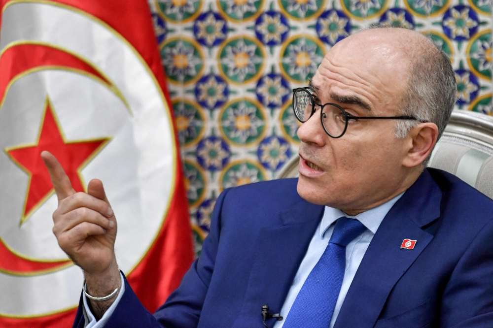 Tunisia's Foreign Minister Nabil Ammar gives an interview at his office in Tunis on February 27, 2023. (Photo by FETHI BELAID / AFP)