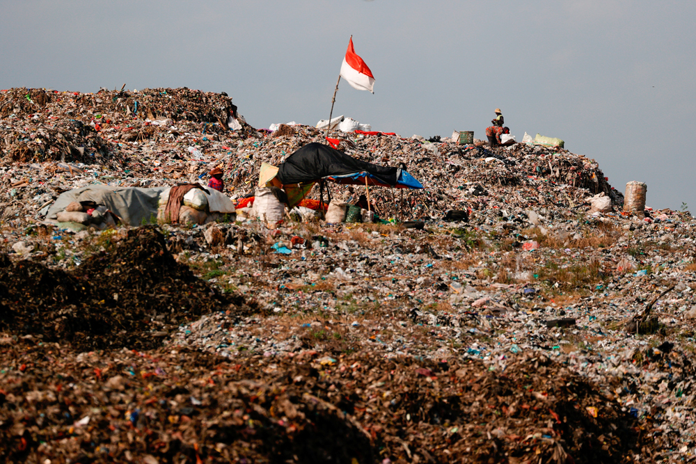 Indonesian national flag is seen at the Bantar Gebang landfill in Bekasi, West Java province, Indonesia.