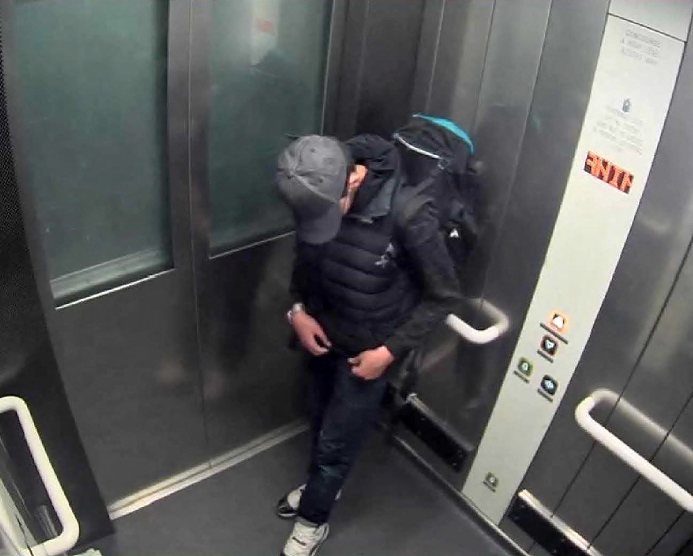 In this file photo taken on May 22, 2017 A handout photo released by the Manchester Arena Inquiry in Manchester, northern England on September 8, 2020, shows suicide bomber Salman Abedi carrying a rucksack in the lift at Victoria Station in Manchester.  (Photo by Manchester Arena Inquiry / AFP)