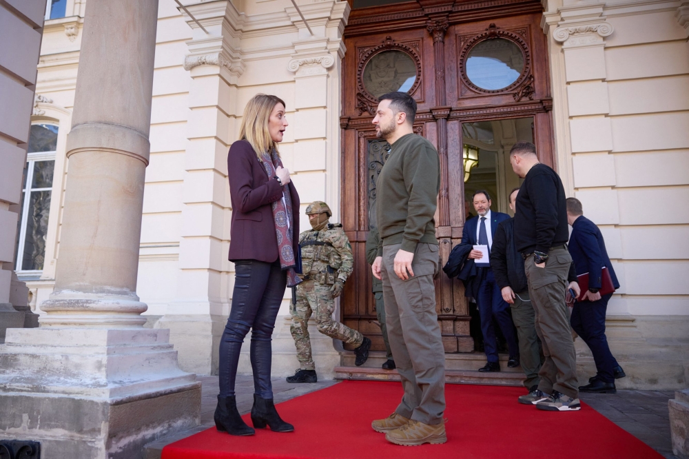 Picture released by the Ukrainian Presidential press service on March 4, 2023, shows Ukrainian President Volodymyr Zelensky (R) with European Parliament President Roberta Metsola (L) after a meeting in Lviv. (Photo by Handout / Ukrainian Presidential Press Service / AFP)
 