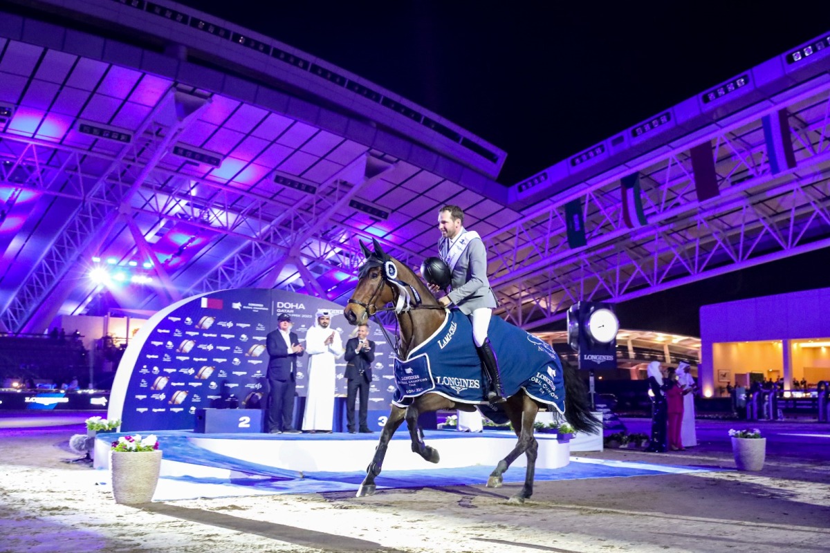 H E Sheikh Joaan bin Hamad Al Thani, President of the Qatar Olympic Committee and Jan Tops, President of the Longines Global Champions Tour applaud as Philipp Weishaupt of Germany arrives at the presentation ceremony after his victory.
