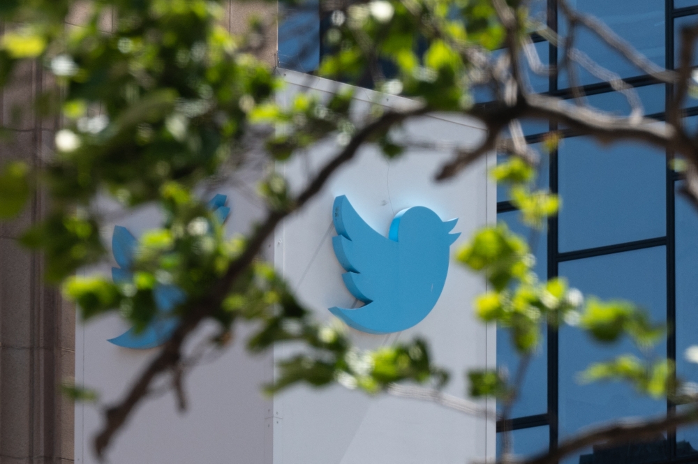In this file photo taken on April 26, 2022 the Twitter logo is seen at their headquarters in downtown San Francisco, California.  (Photo by Amy Osborne / AFP)