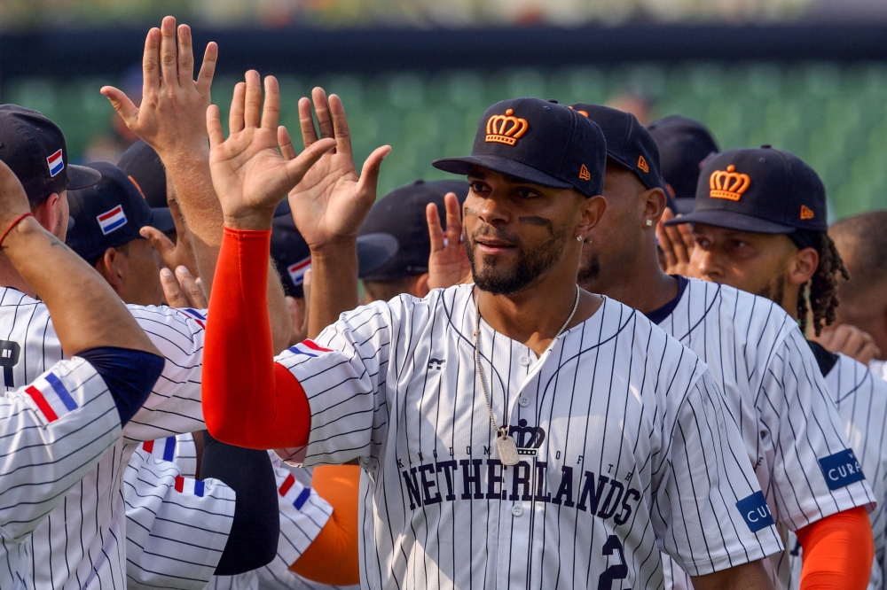 Netherlands' Xander Bogaerts (C) celebrates with teammates after victory during the World Baseball Classic game between Cuba and the Netherlands at Taichung Intercontinental Baseball Stadium in Taichung on March 8, 2023. (Photo by Sam Yeh / AFP)