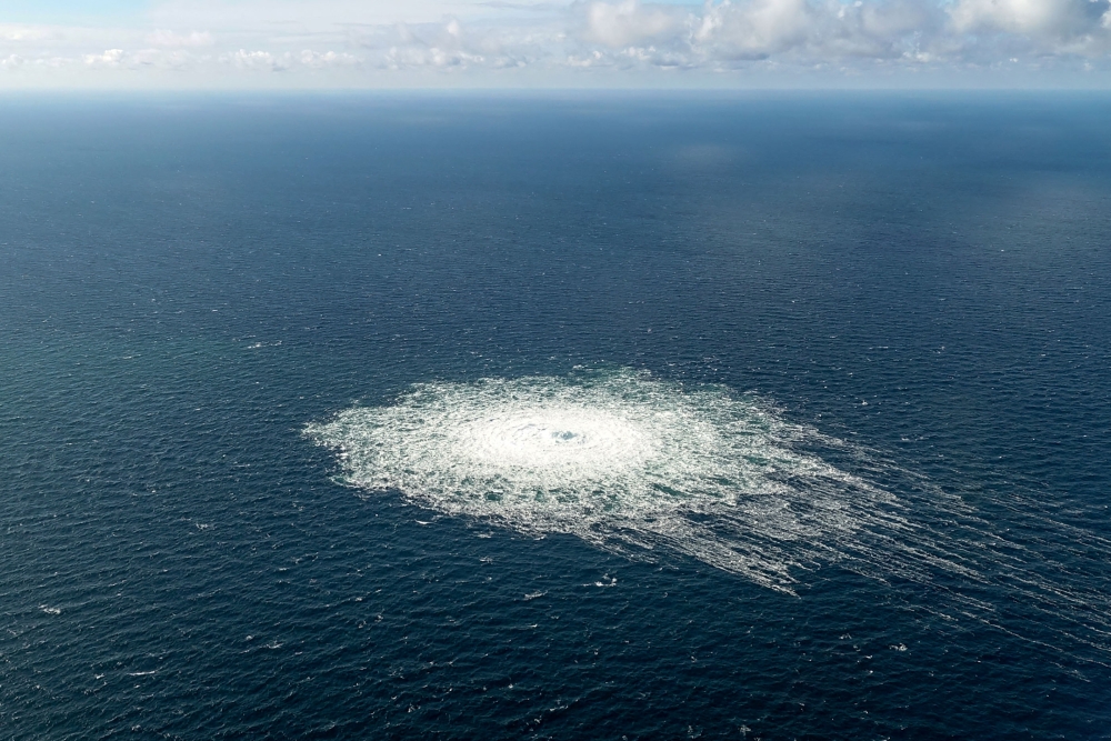 In this file photo taken on September 27, 2022 this handout picture released by the Danish Defence Command shows the gas leak at the Nord Stream 2 gas pipeline as it is seen from the Danish Defence's F-16 rejection response off the Danish Baltic island of Bornholm, south of Dueodde. (Photo by Handout / DANISH DEFENCE / AFP)