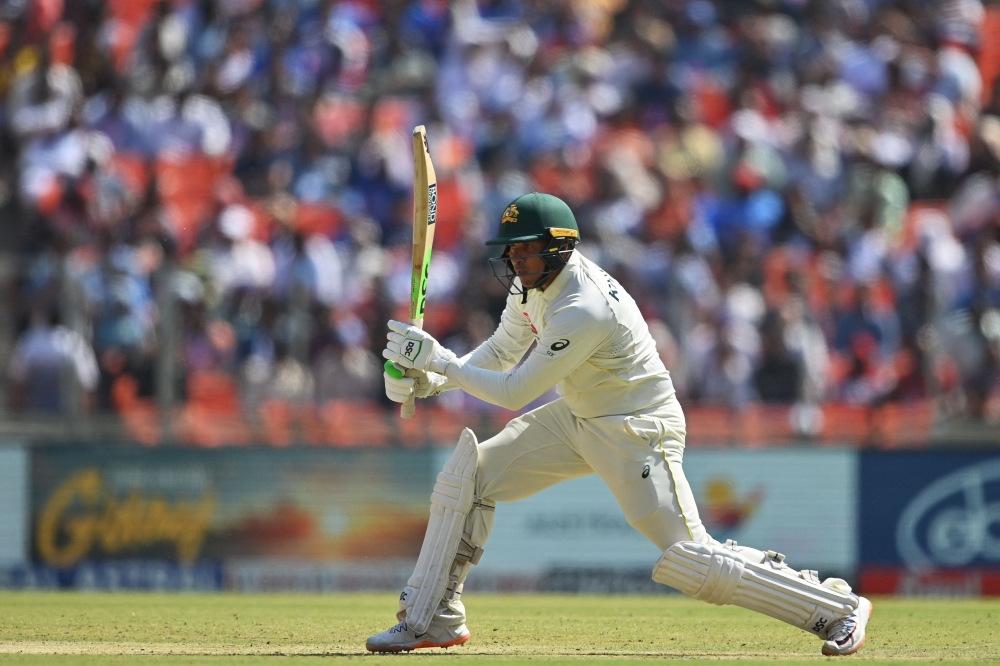 Australia's Usman Khawaja plays a shot during the first day of the fouth and final Test cricket match between India and Australia at the Narendra Modi Stadium in Ahmedabad on March 9, 2023. (Photo by Punit Paranjpe / AFP)