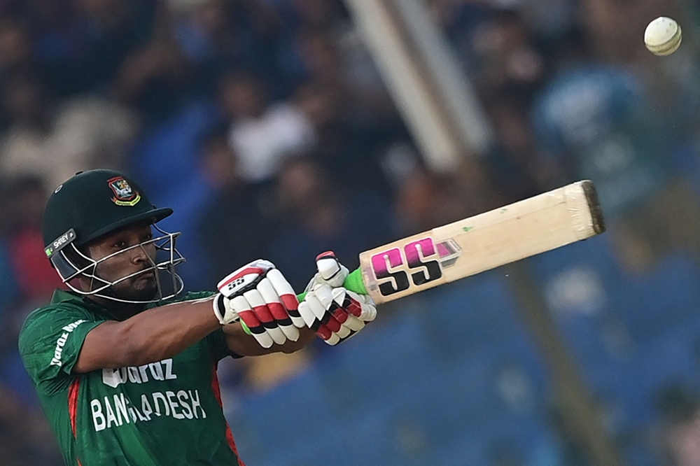 Bangladesh's Najmul Hossain Shanto plays a shot during the first Twenty20 international cricket match between Bangladesh and England at the Zahur Ahmed Chowdhury Stadium in Chittagong on March 9, 2023. (Photo by Munir uz ZAMAN / AFP)