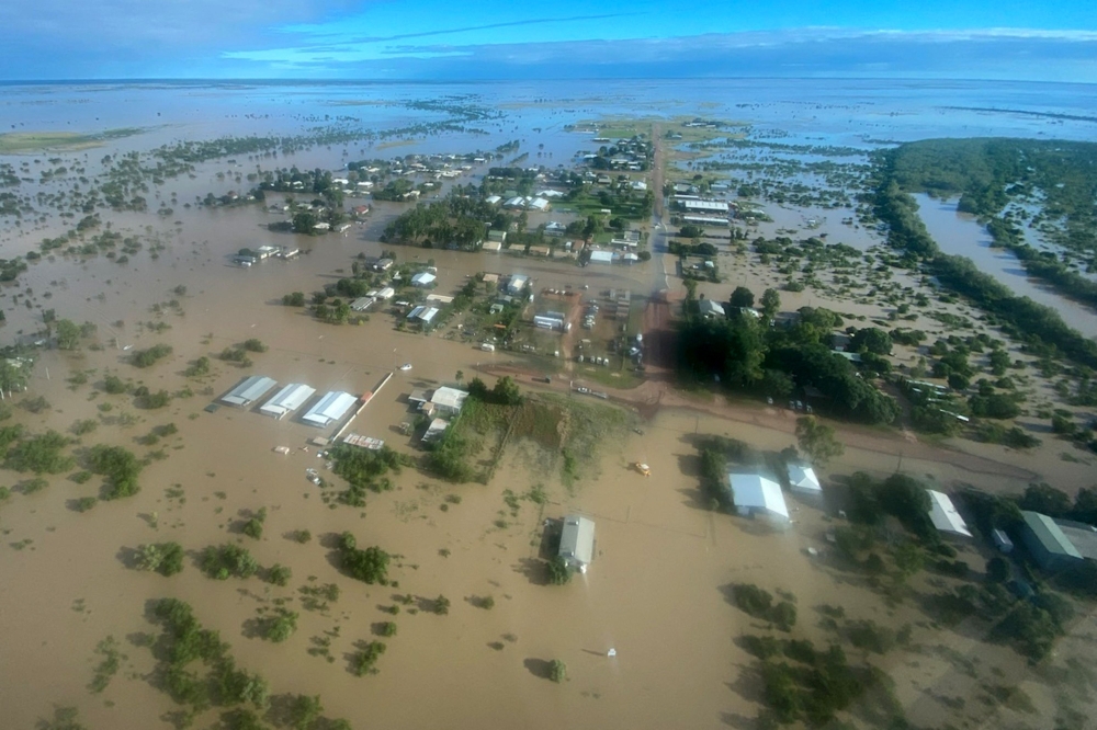 This handout photo taken on March 10, 2023 and received on March 11, 2023 from the Queensland Police Service shows an aerial view of the flooded northern Queensland town of Burketown. (Photo by Handout / QUEENSLAND POLICE SERVICE / AFP) 