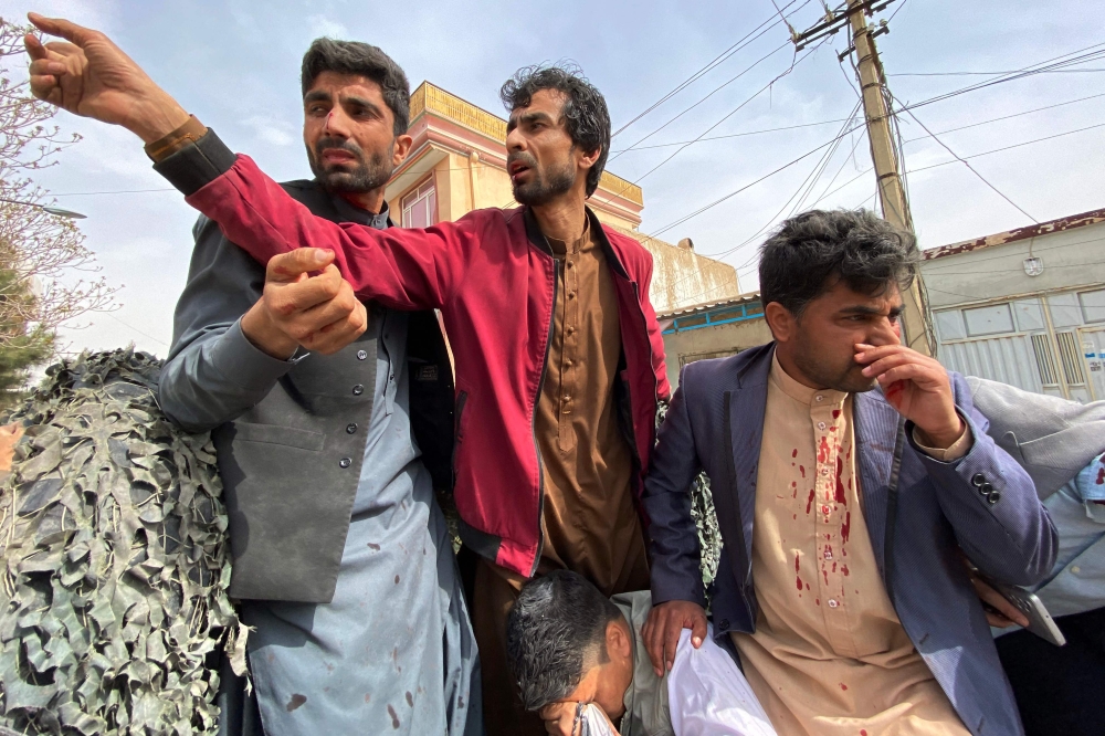 Wounded journalists are shifted on a vehicle to a hospital, in Mazar-i-Sharif on March 11, 2023. (Photo by Atif Aryan / AFP)
