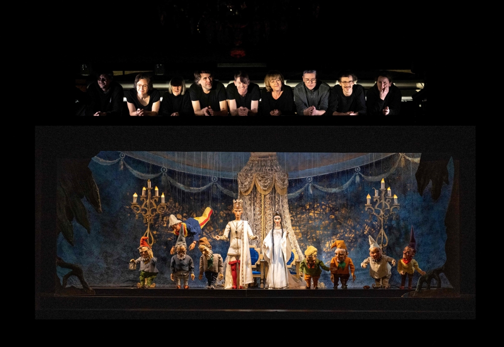 (COMBO) This combination of pictures created on March 10, 2023 shows (L-R) puppeteers Emanuel Paulus, Eva Wiener, Anne-Lise Droin, artistic director Philippe Brunner, Maximilian Kiener, Ursula Winzer, Vladimir Fediakov, Edouard Funck and Marion Mayer show themselves to the audience at the end of Snow White fairytale at the UNESCO recognized Salzburg Marionette Theatre in Salzburg, Austria, on February 14, 2023, and puppets of the Snow White fairytale puppet show stand on stage at the UNESCO recognized Salzburg Marionette Theatre in Salzburg, Austria, on February 14, 2023. (Photo by Joe Klamar / AFP)
 