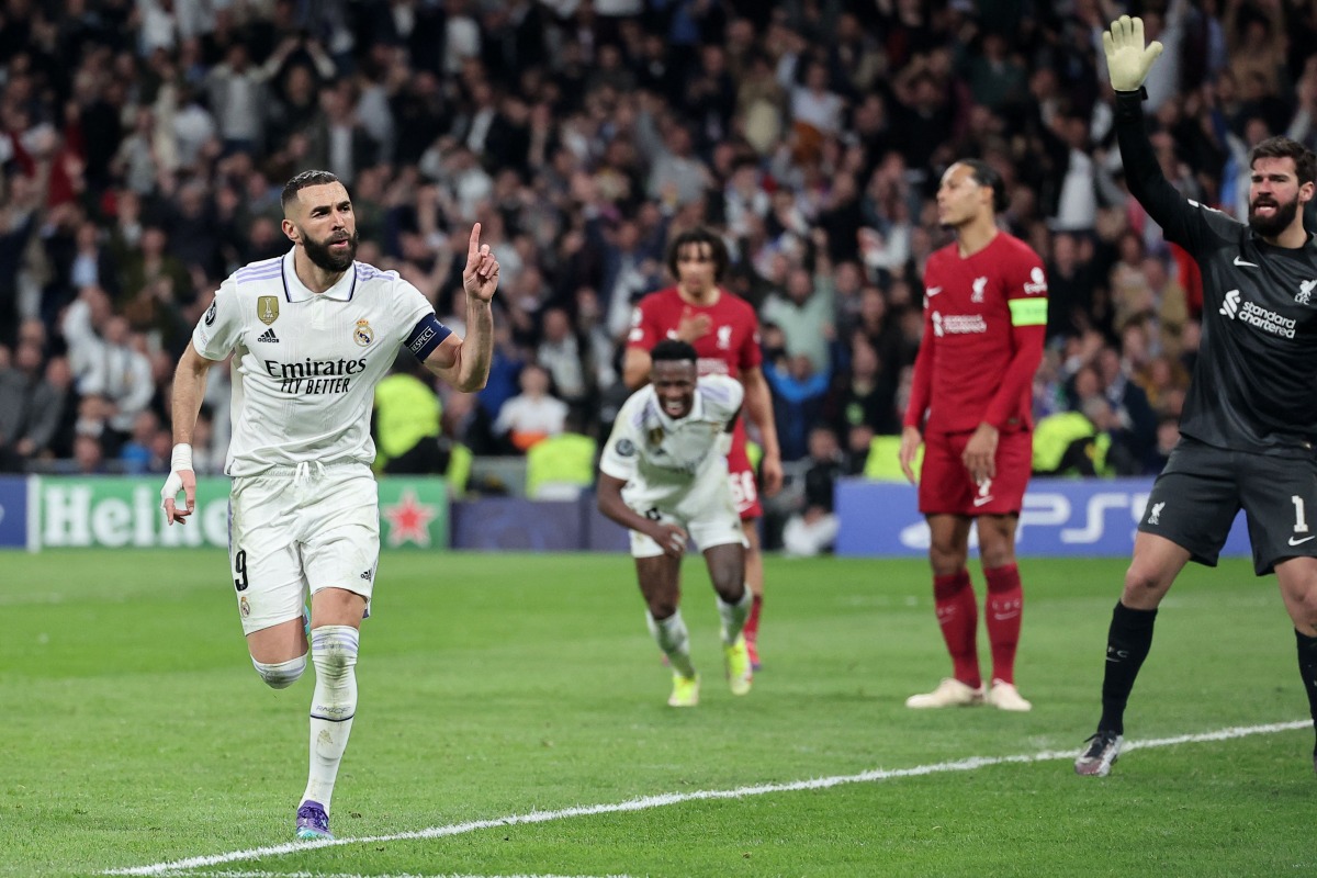 Real Madrid’s French forward Karim Benzema (left) celebrates after scoring a goal against Liverpool, yesterday. AFP