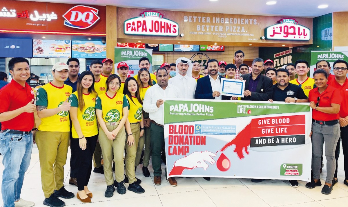 Papa John’s Qatar staff during the blood donation drive. 