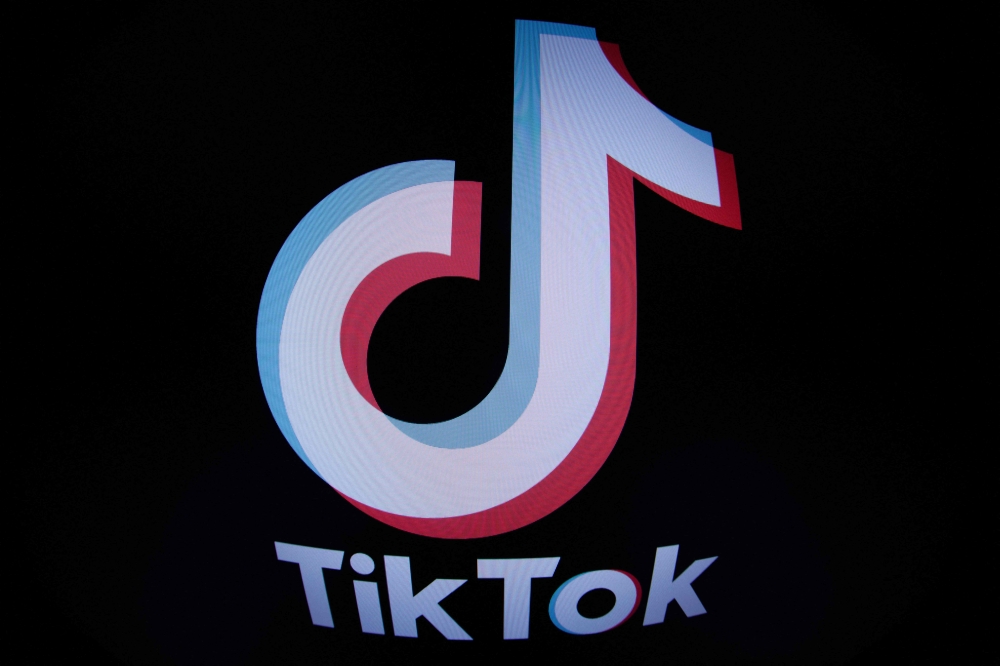 In this file photo taken with a fish-eye lens on March 1, 2023 in Paris shows the social media application logo TikTok. Photo by JOEL SAGET / AFP