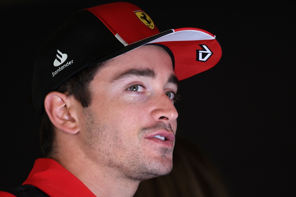 Ferrari's Monegasque driver Charles Leclerc speaks to reporters in the paddock at the Jeddah Corniche Circuit on March 16, 2023, ahead of the 2023 Saudi Arabia Formula One Grand Prix. (Photo by Giuseppe Cacace / AFP)