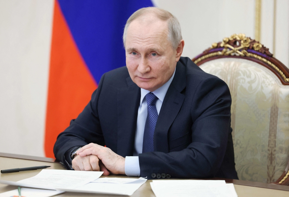 Russian President Vladimir Putin chairs a meeting on the social and economic development of Crimea and Sevastopol via a video link at the Kremlin in Moscow on March 17, 2023. (Photo by Mikhail METZEL / SPUTNIK / AFP)