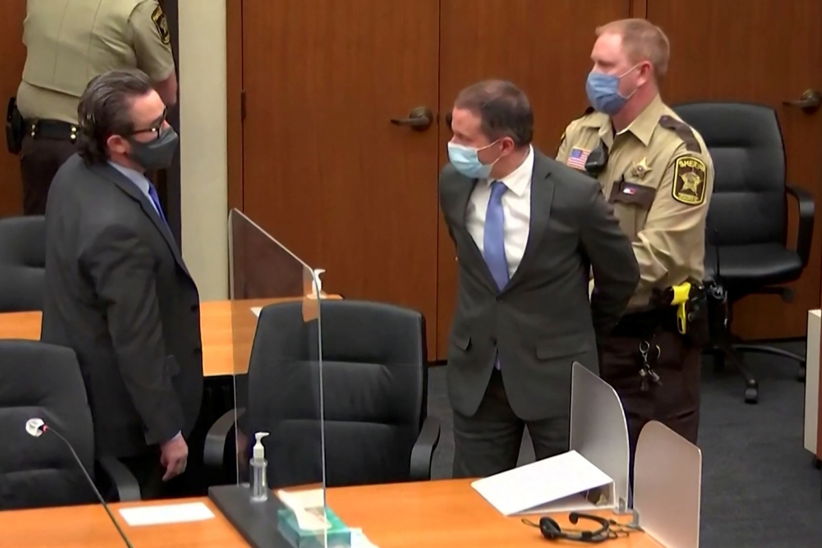 File photo: Former Minneapolis police officer Derek Chauvin is led away in handcuffs past his defense attorney Eric Nelson after a jury found him guilty of all charges in his trial for second-degree murder, third-degree murder and second-degree manslaughter.