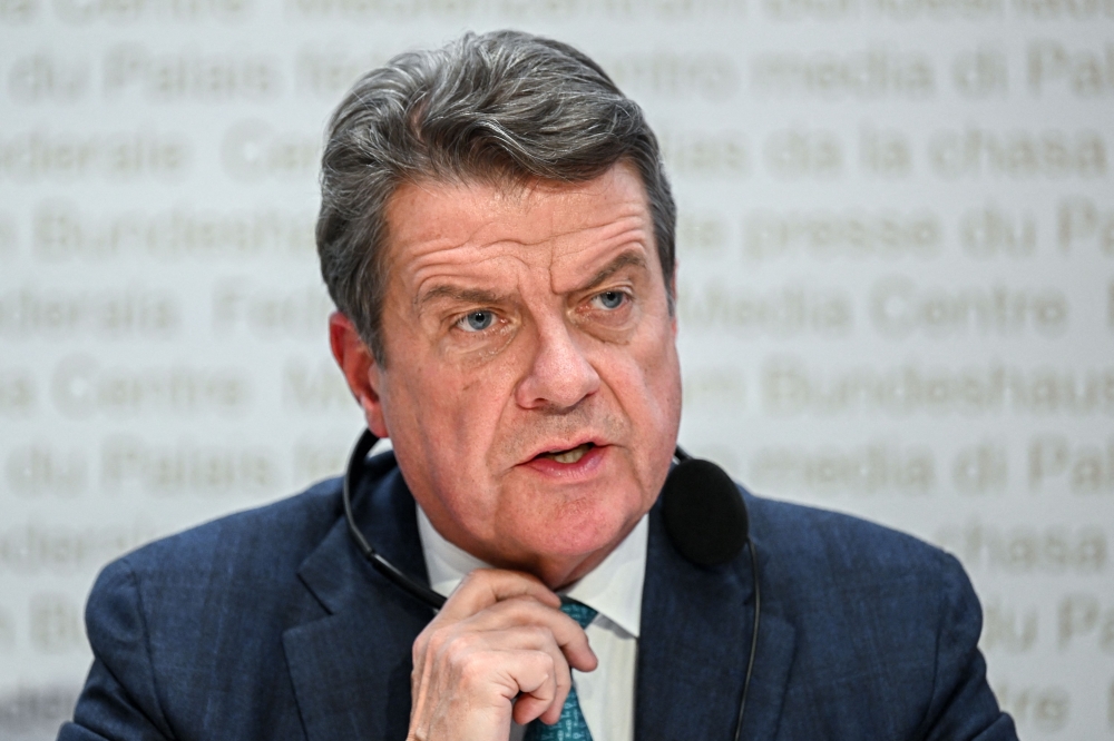 UBS Chairman Colm Kelleher speaks during a press conference after talks over UBS taking over its troubled rival Swiss bank Credit Suisse in Bern on March 19, 2023. (Photo by Fabrice COFFRINI / AFP)