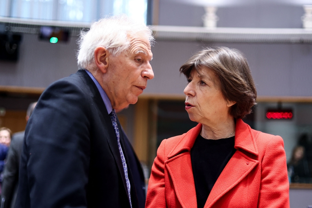 European Commission vice-president in charge for High-Representative of the Union for Foreign Policy and Security Policy Josep Borrell speaks with France's Minister for Europe and Foreign Affairs Catherine Colonna (R) ahead of the Foreign Affairs Council (FAC) at the EU headquarters in Brussels on March 20, 2023. (Photo by Kenzo Tribouillard / AFP)
 
