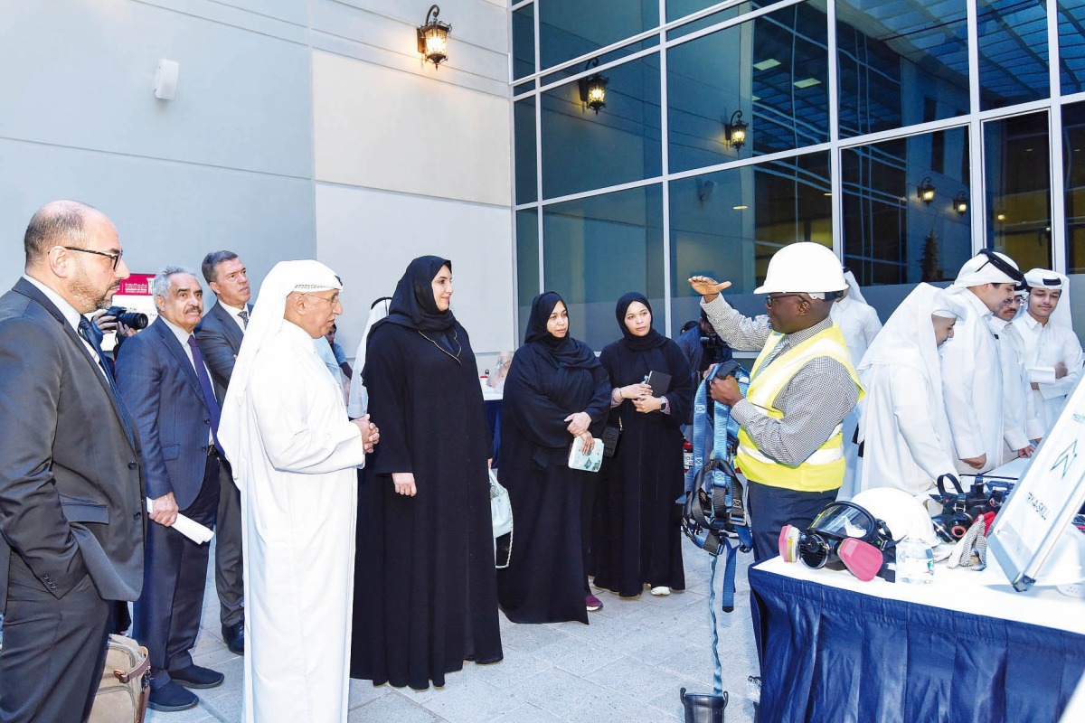 UDST President Dr. Salem Al Naemi and other officials listen to a presentation during the Skills Day event.