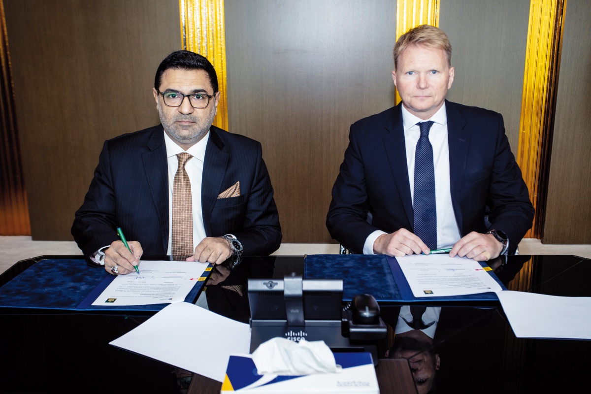 Acting CEO, Chief Treasury and Investment Officer Gudni Stiholt  Adalsteinsson (right) and Divisional Head – Business Development Bank Al Habib Qamber Ali during the agreement signing event. 